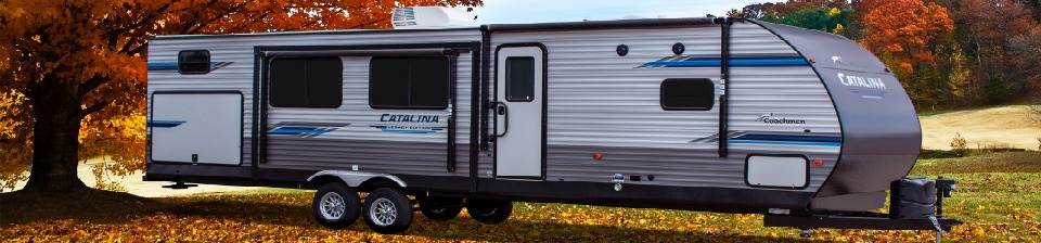 2017 Falcon RV parked under an Autumn tree